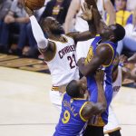 Cleveland Cavaliers forward LeBron James (23) drives on Golden State Warriors forward Draymond Green (23) during the first half of Game 4 of basketball's NBA Finals in Cleveland, Friday, June 9, 2017. (AP Photo/Ron Schwane)