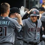 Arizona Diamondbacks' Brandon Drury, right, is congratulated by Zack Greinke (21) after hitting a two-run home run against the Detroit Tigers in the third inning of a baseball game in Detroit, Tuesday, June 13, 2017. (AP Photo/Paul Sancya)