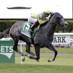 Ascend, ridden by Jose Ortiz, crosses the finish line to win the Woodford Reserve Manhattan at Belmont Park on Saturday, June 10, 2017, in Elmont, N.Y. (AP Photo/Julio Cortez)