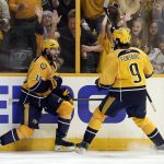 Nashville Predators right wing Craig Smith (15) celebrates his goal against the Pittsburgh Penguins with Filip Forsberg (9), of Sweden, during the third period in Game 3 of the NHL hockey Stanley Cup Finals Saturday, June 3, 2017, in Nashville, Tenn. (AP Photo/Mark Humphrey)