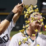 Arizona Diamondbacks' Chris Herrmann, right, gets a bucket of bubble gum dumped onto his head by David Peralta, left, after Herrmann delivered the game-winning single against the St. Louis Cardinals in a baseball game Tuesday, June 27, 2017, in Phoenix. The Diamondbacks defeated the Cardinals 6-5. (AP Photo/Ross D. Franklin)