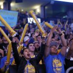 Fans cheer as they watch television coverage of Game 4 of basketball's NBA Finals between the Golden State Warriors and the Cleveland Cavaliers, Friday, June 9, 2017, at Oracle Arena in Oakland, Calif. (AP Photo/Marcio Jose Sanchez)