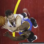 Cleveland Cavaliers forward Kevin Love, left, shoots over Golden State Warriors forward Draymond Green during the first half of Game 4 of basketball's NBA Finals in Cleveland, Friday, June 9, 2017. (AP Photo/Ron Schwane, Pool)