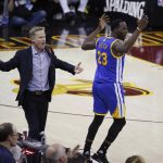Golden State Warriors coach Steve Kerr and forward Draymond Green (23) react to a foul call during the first half of Game 4 in the basketball team's NBA Finals against the Cleveland Cavaliers in Cleveland, Friday, June 9, 2017. (AP Photo/Ron Schwane)