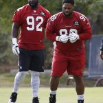 Arizona Cardinals defensive tackles Corey Peters, right, and Frostee Rucker (92) run drills during an NFL football organized team activity, Thursday, June 1, 2017, at the team training facility in Tempe, Ariz. (AP Photo/Ross D. Franklin)