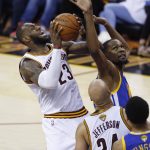 Cleveland Cavaliers forward LeBron James (23) shoots over Golden State Warriors forward Kevin Durant, top right, during the first half of Game 4 of basketball's NBA Finals in Cleveland, Friday, June 9, 2017. (AP Photo/Ron Schwane)