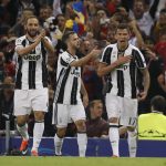 Juventus' Mario Mandzukic, right, celebrates with teammates Juventus' Miralem Pjanic, center, and Gonzalo Higuain, after scoring scores during the Champions League final soccer match between Juventus and Real Madrid at the Millennium Stadium in Cardiff, Wales, Saturday June 3, 2017. (AP Photo/Kirsty Wigglesworth)