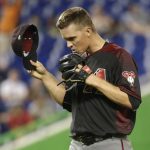 Arizona Diamondbacks starting pitcher Zack Greinke adjusts his cap after Miami Marlins' Giancarlo Stanton hit a two-run single during the third inning of a baseball game, Thursday, June 1, 2017, in Miami. (AP Photo/Lynne Sladky)