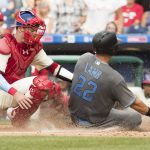 Arizona Diamondbacks' Jake Lamb, right, gets tagged out at home by Philadelphia Phillies catcher Andrew Knapp, left, during the sixth inning of a baseball game, Saturday, June 17, 2017, in Philadelphia. (AP Photo/Chris Szagola)
