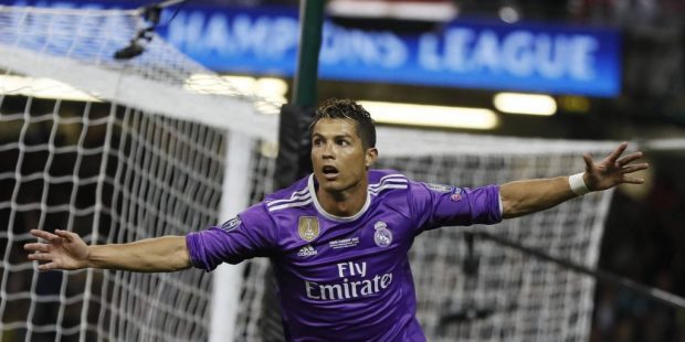 Real Madrid's Cristiano Ronaldo celebrates after scoring the opening goal during the Champions Leag...