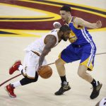 Cleveland Cavaliers guard Kyrie Irving (2) drives on Golden State Warriors guard Klay Thompson (11) during the first half of Game 4 of basketball's NBA Finals in Cleveland, Friday, June 9, 2017. (AP Photo/Ron Schwane)