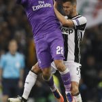 Real Madrid's Isco, left, challenges for the ball with Juventus' Miralem Pjanic during the Champions League final soccer match between Juventus and Real Madrid at the Millennium Stadium in Cardiff, Wales, Saturday June 3, 2017. (AP Photo/Kirsty Wigglesworth)