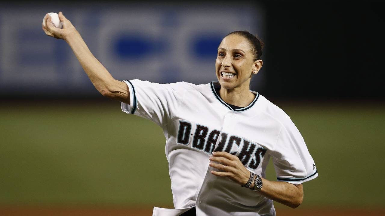 Phoenix Mercury's Diana Taurasi throws out the first pitch prior to a baseball game between the Ari...