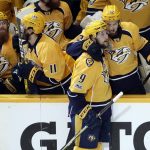Nashville Predators left wing Filip Forsberg (9), of Sweden, is congratulated by Frederick Gaudreau (32) after Forsberg scored an empty net goal against the Pittsburgh Penguins during the third period in Game 4 of the NHL hockey Stanley Cup Finals Monday, June 5, 2017, in Nashville, Tenn. The Predators won 4-1 to tie the series 2-2. (AP Photo/Mark Humphrey)