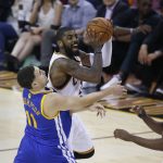Cleveland Cavaliers guard Kyrie Irving shoots over Golden State Warriors guard Klay Thompson (11) during the first half of Game 4 of basketball's NBA Finals in Cleveland, Friday, June 9, 2017. (AP Photo/Ron Schwane)