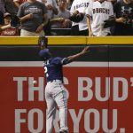 San Diego Padres' Jose Pirela jumps in vain for a ball hit over his head by Arizona Diamondbacks' Gregor Blanco during the first inning of a baseball game Tuesday, June 6, 2017, in Phoenix. The Diamondbacks' Blanco would double on the play and later score a run. (AP Photo/Ross D. Franklin)