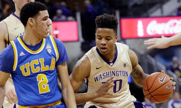 Washington's Markelle Fultz (20) is defended by UCLA's Lonzo Ball during the first half of an NCAA ...