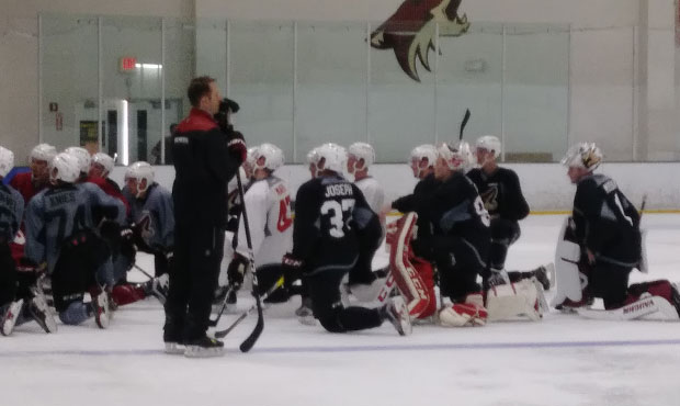 Coyotes prospects take a knee and listen to instructions for their next drill at Coyotes developmen...
