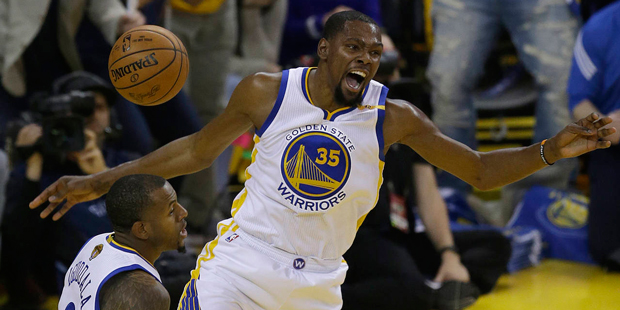 Golden State Warriors forward Kevin Durant (35) reacts after dunking against the Cleveland Cavalier...