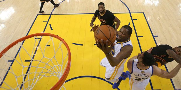 Golden State Warriors forward Kevin Durant shoots against the Cleveland Cavaliers during the first ...