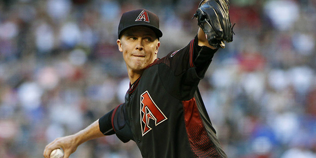 Arizona Diamondbacks' Zack Greinke throws a pitch against the Colorado Rockies during the second in...