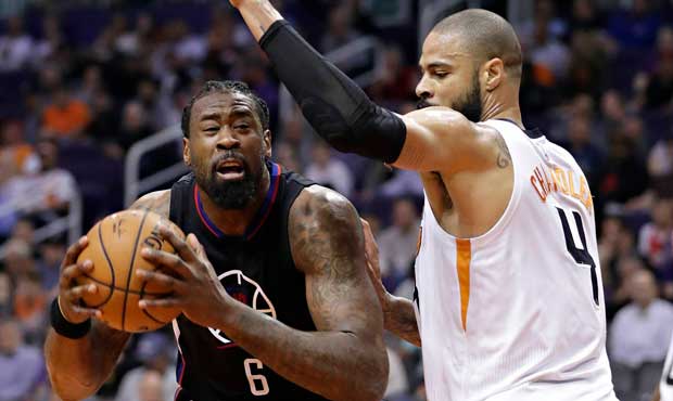 Los Angeles Clippers center DeAndre Jordan (6) drives against Phoenix Suns center Tyson Chandler (4...