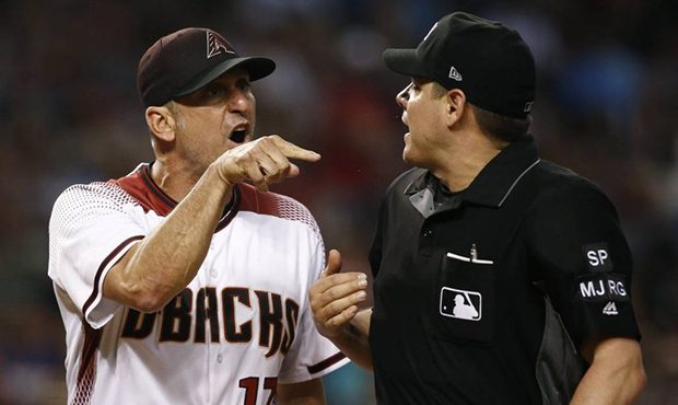 Arizona Diamondbacks manager Torey Lovullo (17) argues with umpire D.J. Reyburn, right, after Lovul...