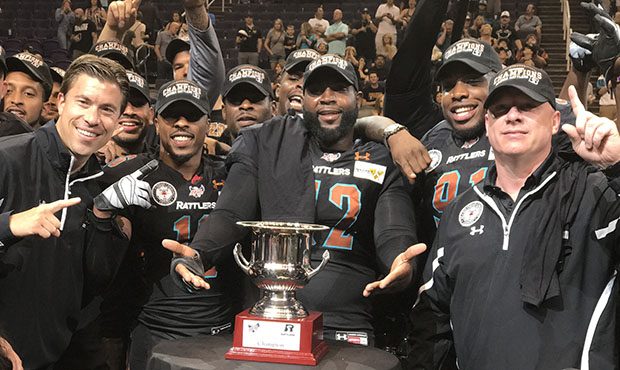 Head coach Kevin Guy (right) and members of the Arizona Rattlers pose with the Intense Conference C...