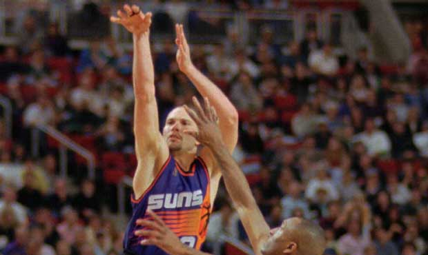 Phoenix Suns Rex Chapman (3) takes a 3-point shot in the fourth quarter as Seattle SuperSonics Hers...