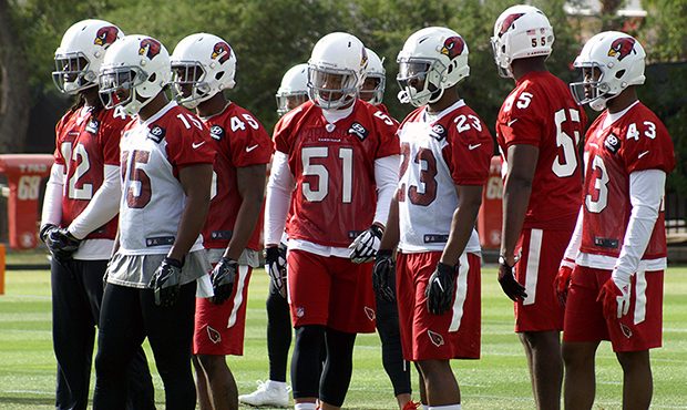 Cardinals players prepare for the next rep during Arizona Cardinals OTAs Tuesday, May 16. (Photo by...