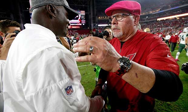 Arizona Cardinals head coach Bruce Arians, right, greets New York Jets head coach Todd Bowles after...