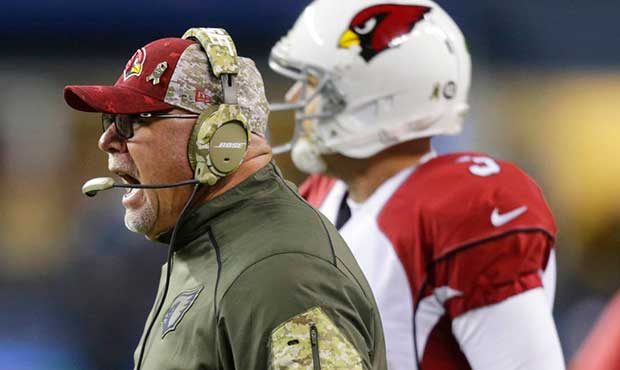 Arizona Cardinals coach Bruce Arians yells as he stands next to quarterback Carson Palmer during th...