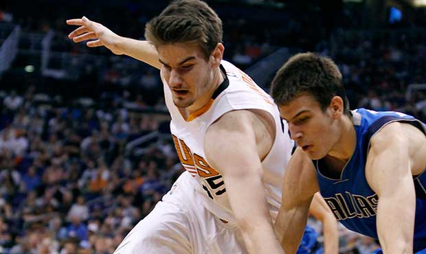 Phoenix Suns forward Dragan Bender, left, and Dallas Mavericks guard Nicolas Brussino chase down a ...