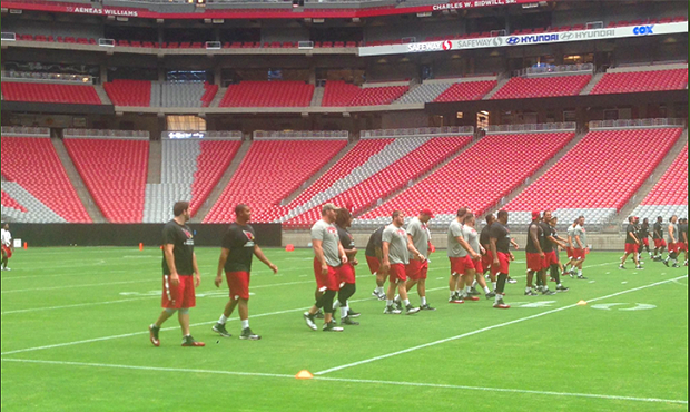 Members of the Arizona Cardinals at the team's annual run test to start training camp at University...