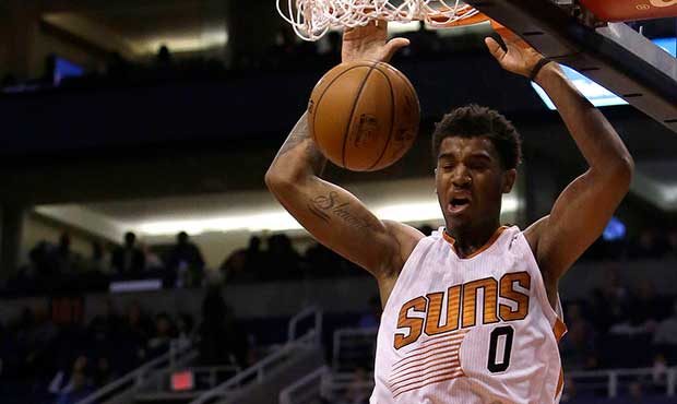 Phoenix Suns forward Marquese Chriss (0) dunks over Charlotte Hornets center Frank Kaminsky III in ...