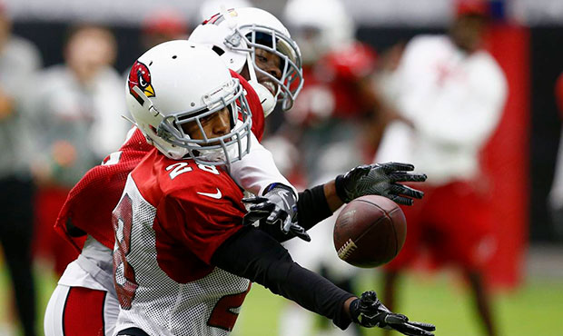 Arizona Cardinals defensive back Justin Bethel (28) breaks up a pass intended for receiver John Brown, left, during an NFL football training camp Monday, July 24, 2017, in Glendale, Ariz. (AP Photo/Ross D. Franklin)