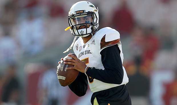 Arizona State quarterback Manny Wilkins (5) warms up before an NCAA college football game against S...