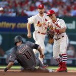 Arizona Diamondbacks' A.J. Pollock, left is out at second as St. Louis Cardinals second baseman Kolten Wong, right, fails to turn the double play and shortstop Paul DeJong watches during the first inning of a baseball game Saturday, July 29, 2017, in St. Louis. Jake Lamb was safe at first. (AP Photo/Jeff Roberson)