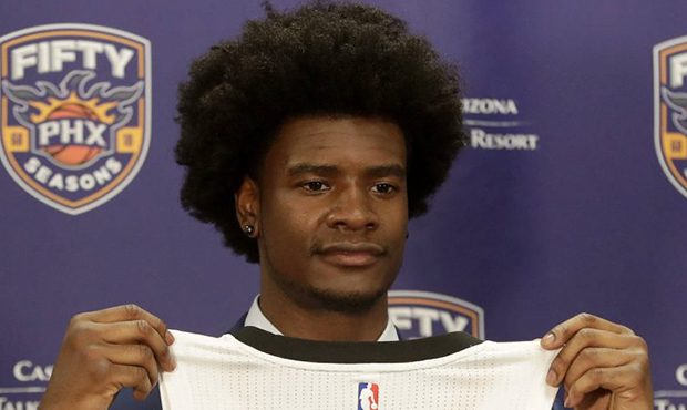Phoenix Suns first-round NBA basketball draft pick Josh Jackson holds his jersey, Friday, June 23, ...