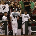 Arizona Diamondbacks Paul Goldschmidt (44) celebrates with manager Torey Lovullo (17) after hitting a solo home run against the Cincinnati Reds in the fifth inning during a baseball game, Friday, July 7, 2017, in Phoenix. (AP Photo/Rick Scuteri)
