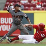 Arizona Diamondbacks shortstop Ketel Marte (4) forces out Cincinnati Reds' Jose Peraza and turns the double play to first to put out Patrick Kivlehan in the seventh inning of a baseball game, Thursday, July 20, 2017, in Cincinnati. (AP Photo/John Minchillo)