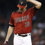 Arizona Diamondbacks' Robbie Ray pauses on the mound on his way to giving up four runs to the Washington Nationals during the first inning of a baseball game Sunday, July 23, 2017, in Phoenix. (AP Photo/Ross D. Franklin)