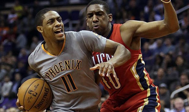 Phoenix Suns guard Brandon Knight (11) drives on New Orleans Pelicans guard Langston Galloway in th...