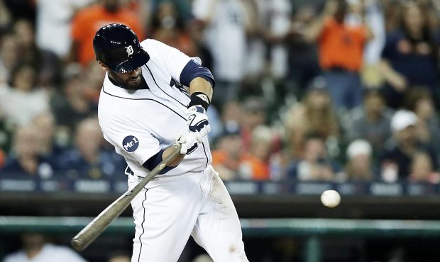 Detroit Tigers' J.D. Martinez connects for a grand slam during the seventh inning of a baseball gam...
