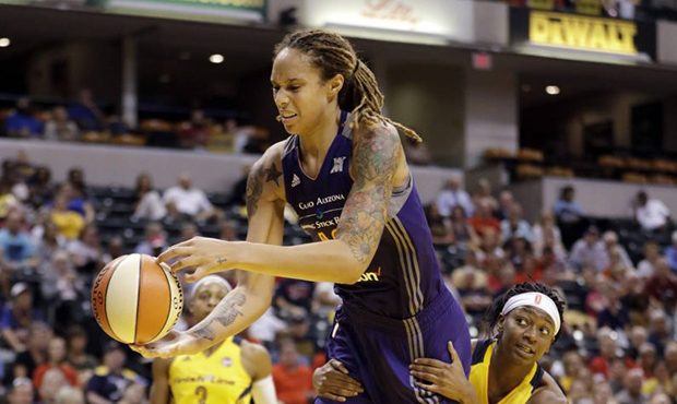 Phoenix Mercury's Brittney Griner (42) is fouled by Indiana Fever's Erica Wheeler (17) during the s...
