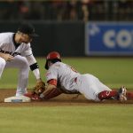Cincinnati Reds' Billy Hamilton (6) is called out after batter interference on Zack Cozart as the tag by Arizona Diamondbacks second baseman Brandon Drury is late in the first inning during a baseball game, Friday, July 7, 2017, in Phoenix. (AP Photo/Rick Scuteri)