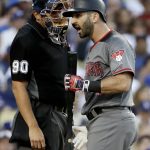 Arizona Diamondbacks' Daniel Descalso, right, argues a third strike call with home plate umpire Mark Ripperger during the fifth inning of a baseball game in Los Angeles, Tuesday, July 4, 2017. (AP Photo/Chris Carlson)