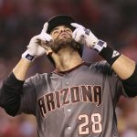 Arizona Diamondbacks' J.D. Martinez reacts as he crosses home plate after hitting a grand slam against the St. Louis Cardinals during the fourth inning of a baseball game Thursday, July 27, 2017, at Busch Stadium in St. Louis. (Chris Lee/St. Louis Post-Dispatch via AP)