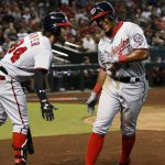 Washington Nationals' Wilmer Difo, right, celebrates his home run against the Arizona Diamondbacks with Bryce Harper (34) during the seventh inning of a baseball game Sunday, July 23, 2017, in Phoenix. (AP Photo/Ross D. Franklin)