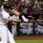 Arizona Diamondbacks' Brandon Drury connects for a run-scoring double against the Colorado Rockies during the sixth inning of a baseball game, Sunday, July 2, 2017, in Phoenix. (AP Photo/Ross D. Franklin)